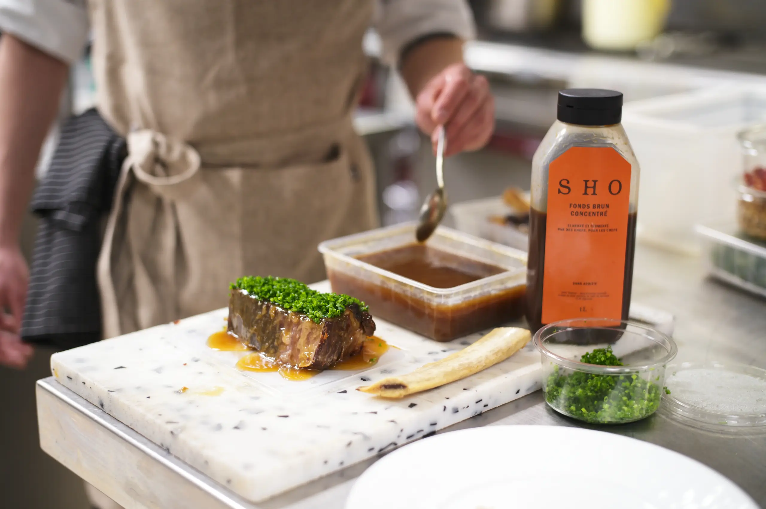Beef sausage meat reduction made with roasted vegetables and EATTT Dark Stock."
