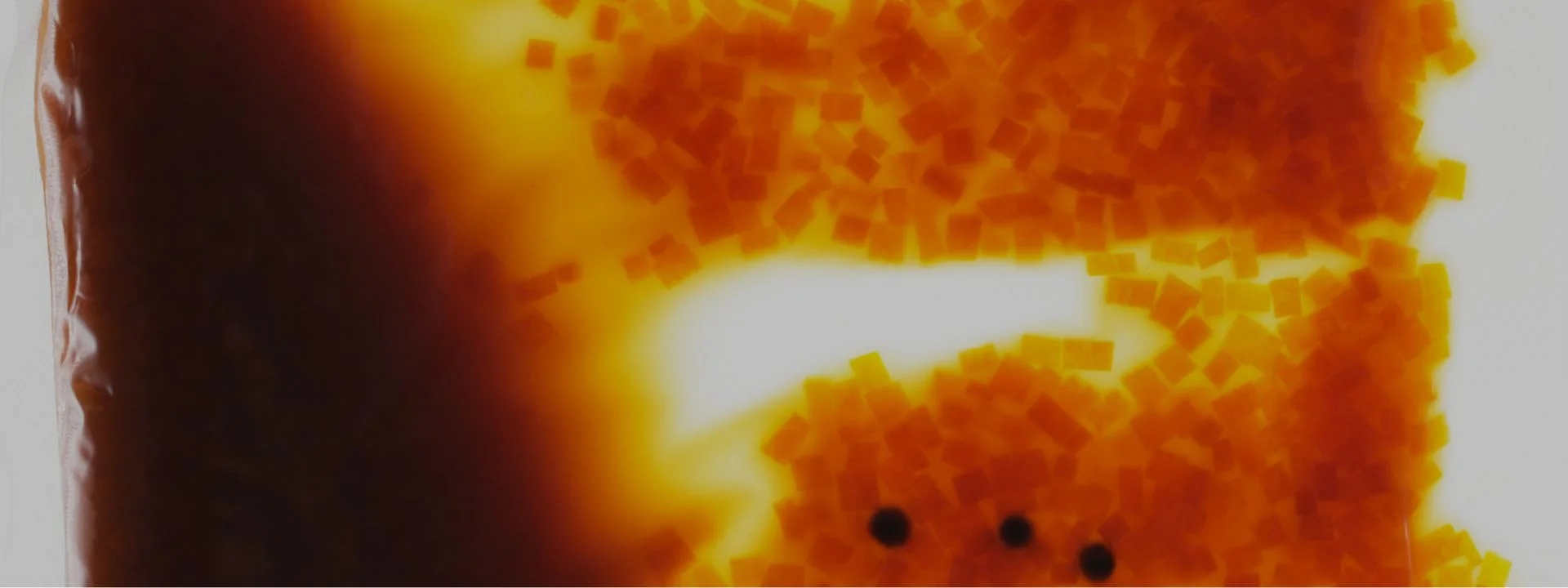 Abstract close-up of amber sauce texture with a call-to-action to contact EATTT and build better food