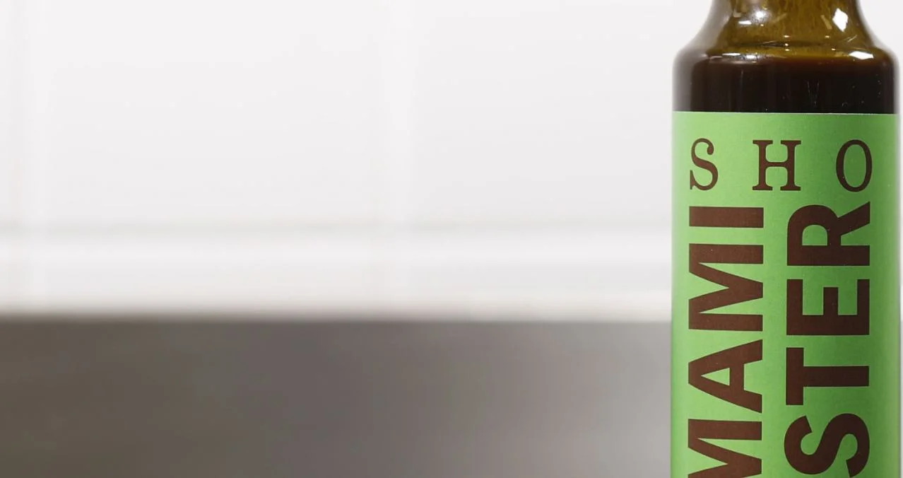 Close-up of SHO Umami Booster bottle for adding savoury depth